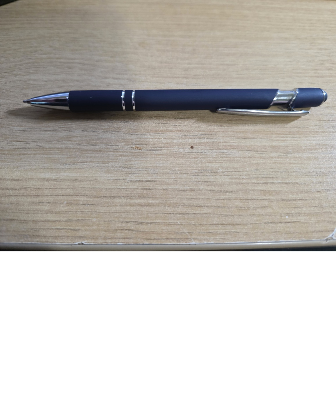 Logo pen in navy blue with a smooth metal barrel, polished chrome accents, clip and ballpoint tip