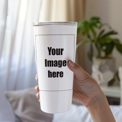 Hand holding white tumbler